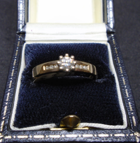 ladies single stone diamond ring with diamond set shoulder image 0